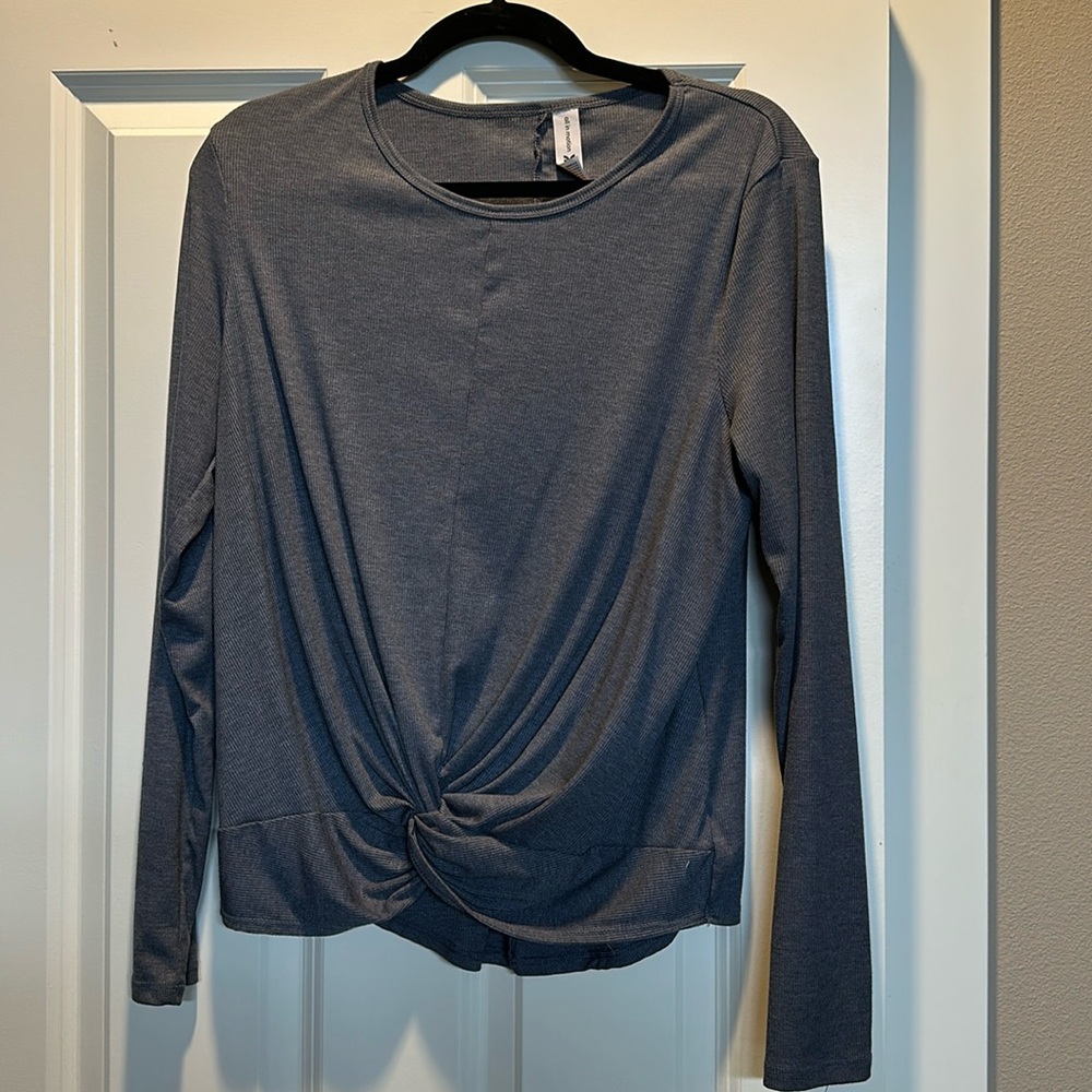 Cute top with knot in bottom.